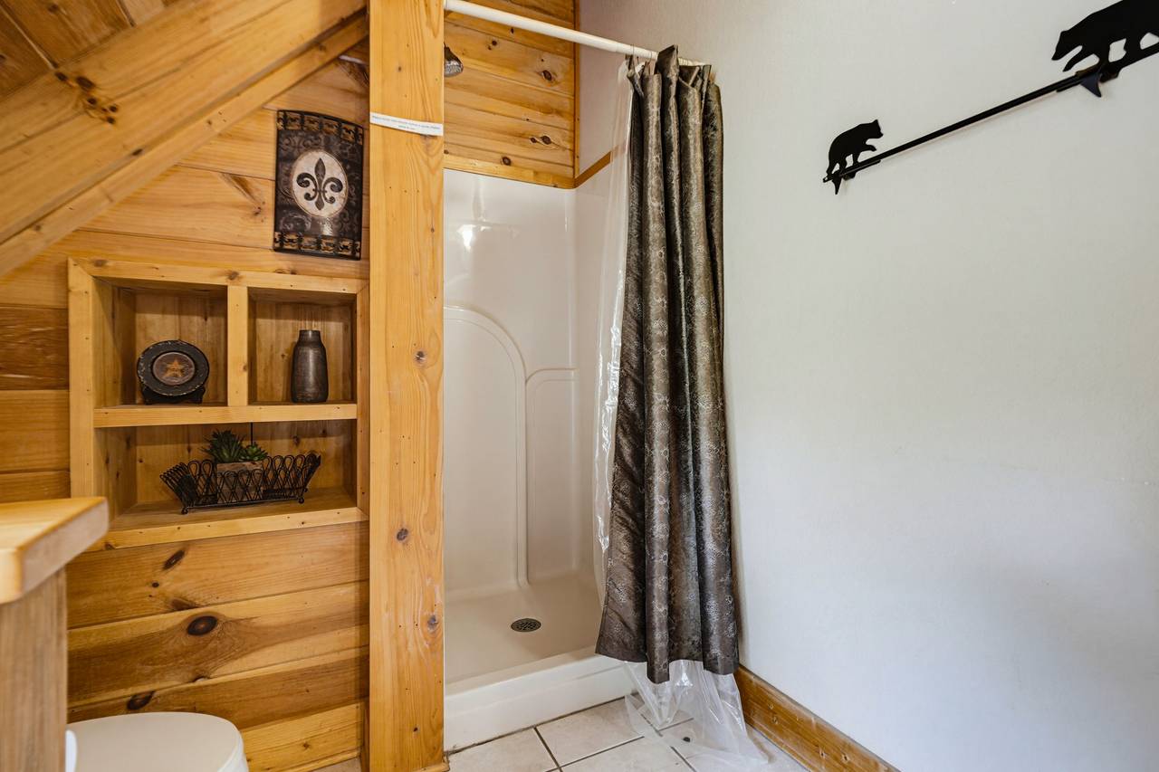 <span class="name">Primary ensuite bathroom with jetted tub and standing shower</span> <span class="name">Primary ensuite bathroom with jetted tub and standing shower</span>