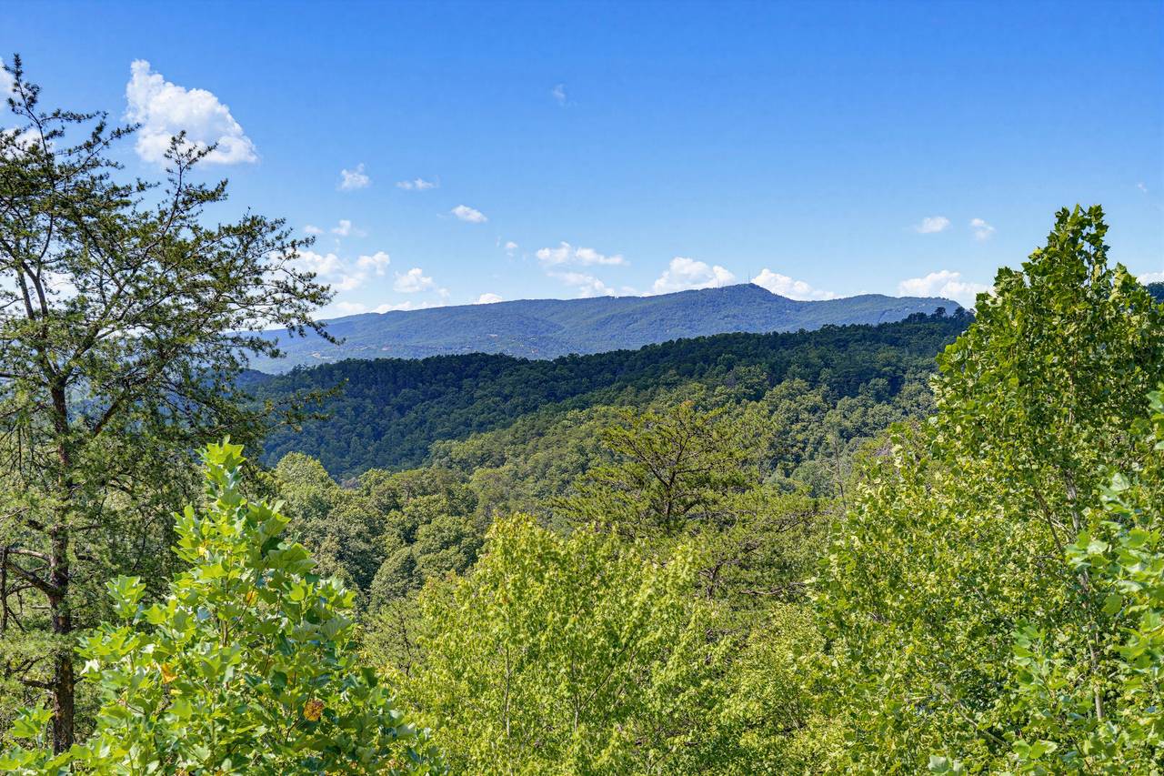 <span class="name">Take in sweeping mountain views from the cabin's decks</span> <span class="name">Take in sweeping mountain views from the cabin's decks</span>