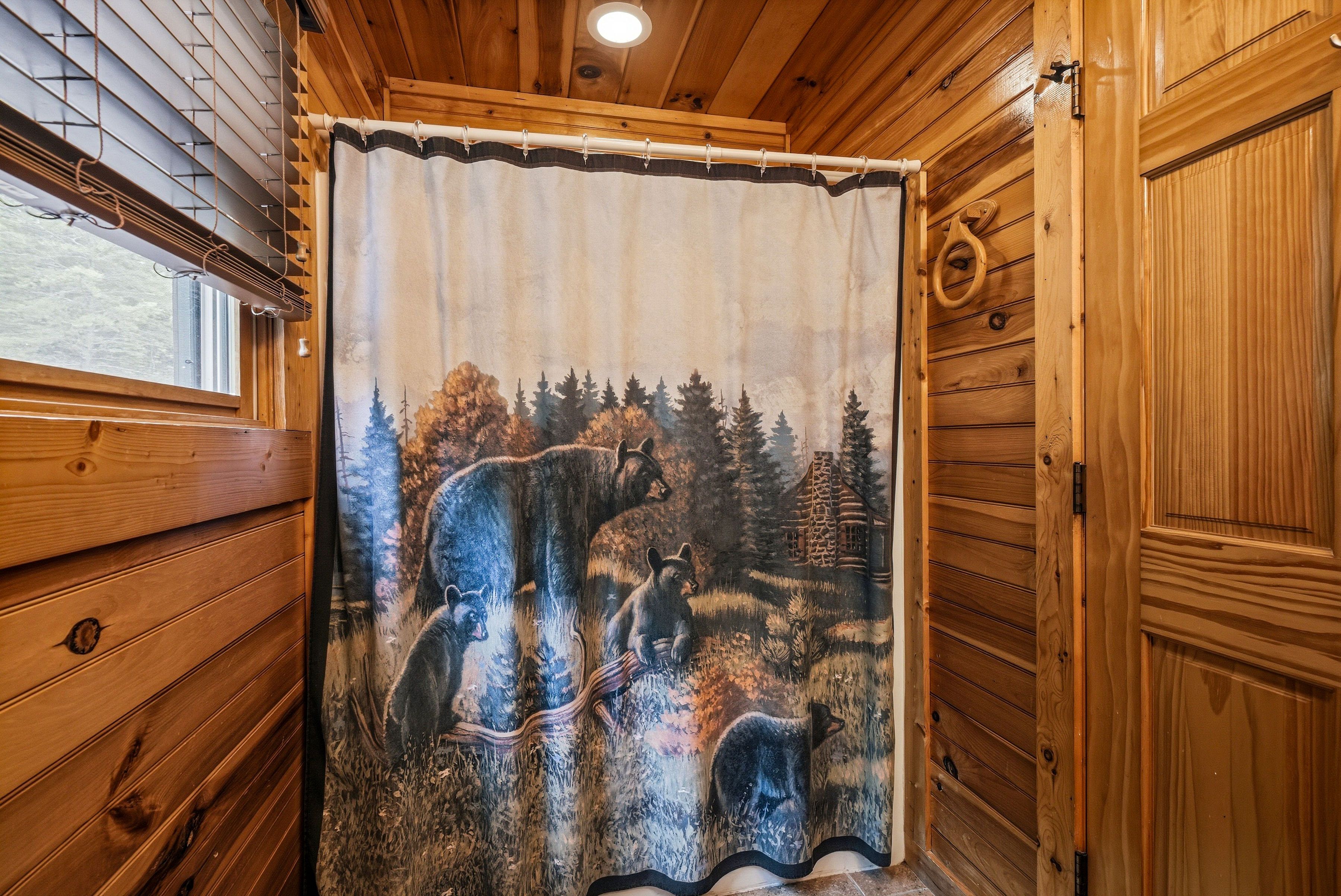 Entry level full bathroom with tub shower combo