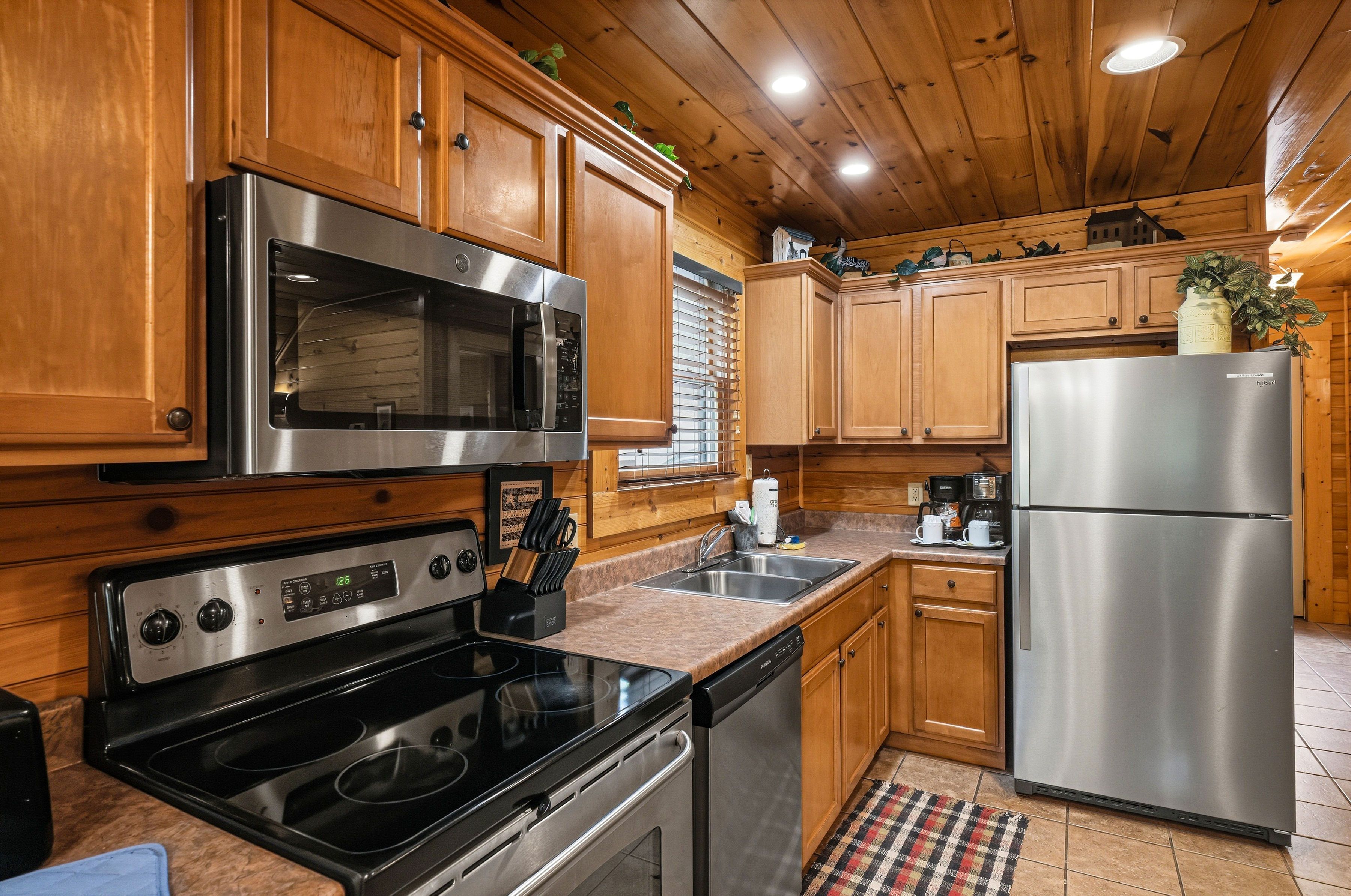 Kitchen with modern appliances and cookware