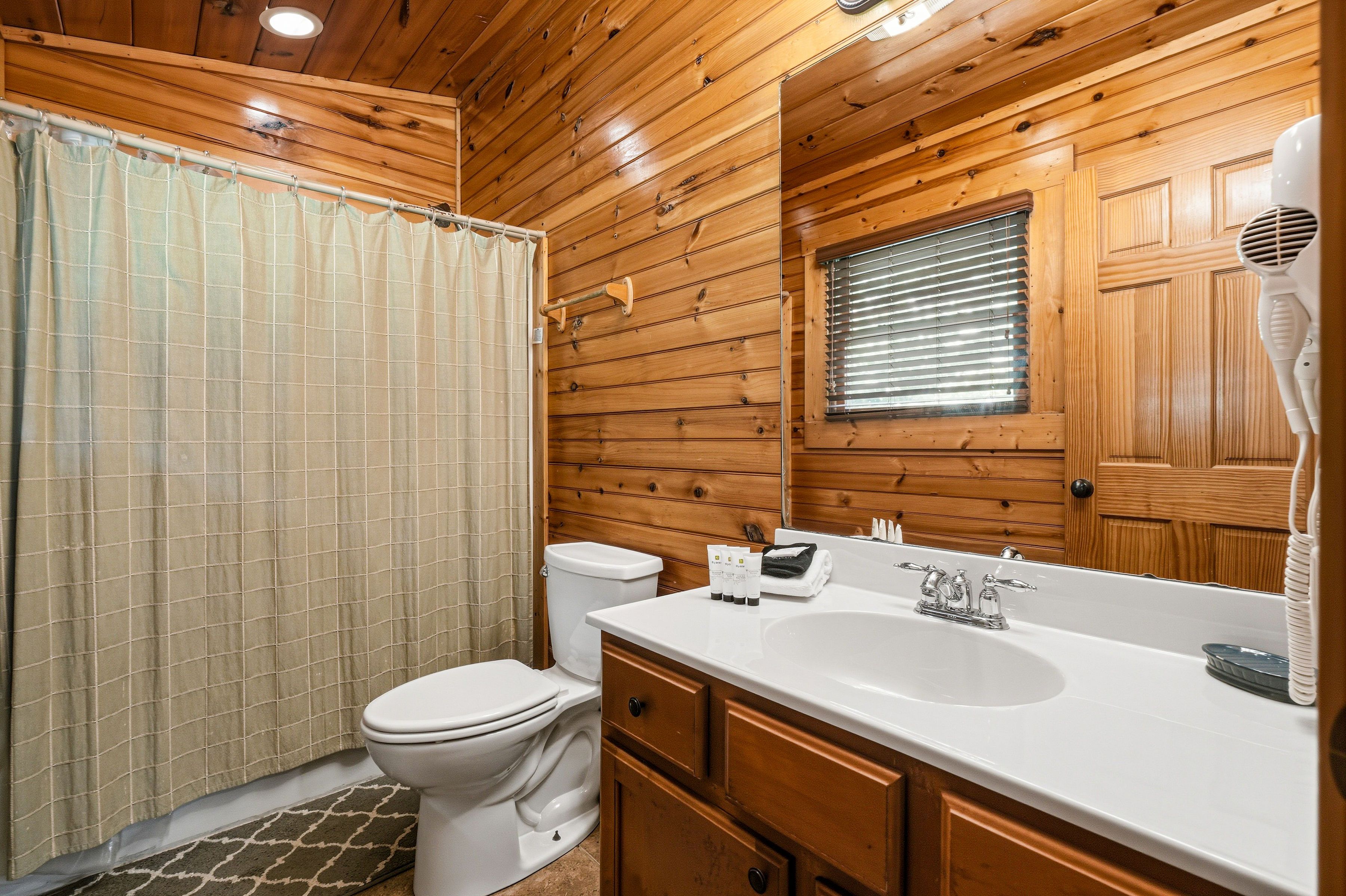 Bathroom with tub shower combo and vanity