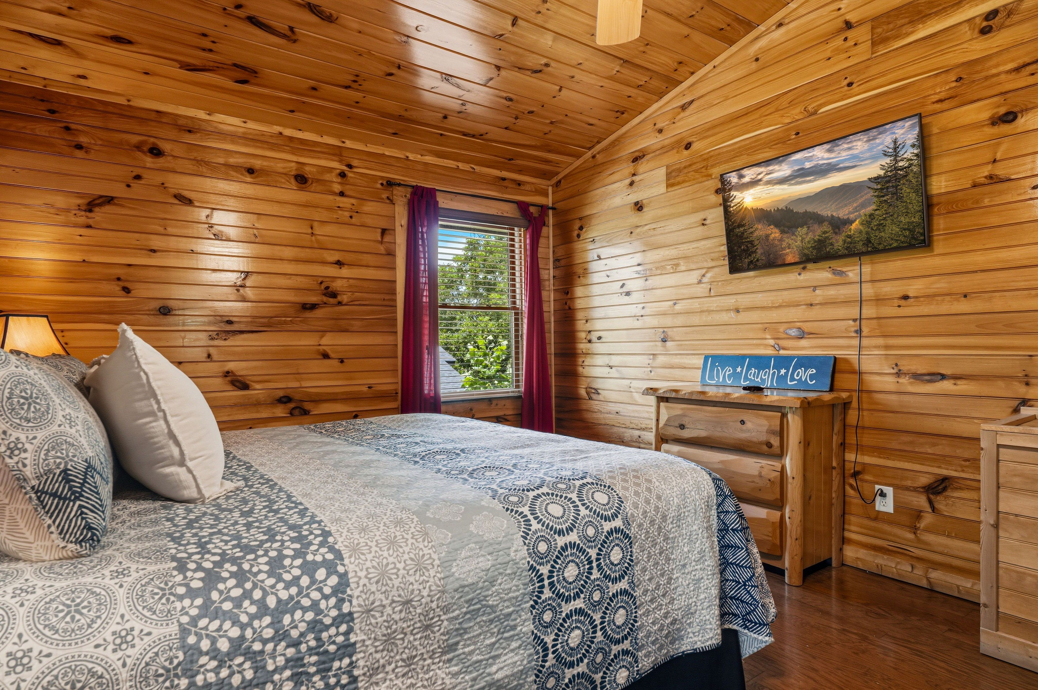 Upper level king bedroom with electric fireplace