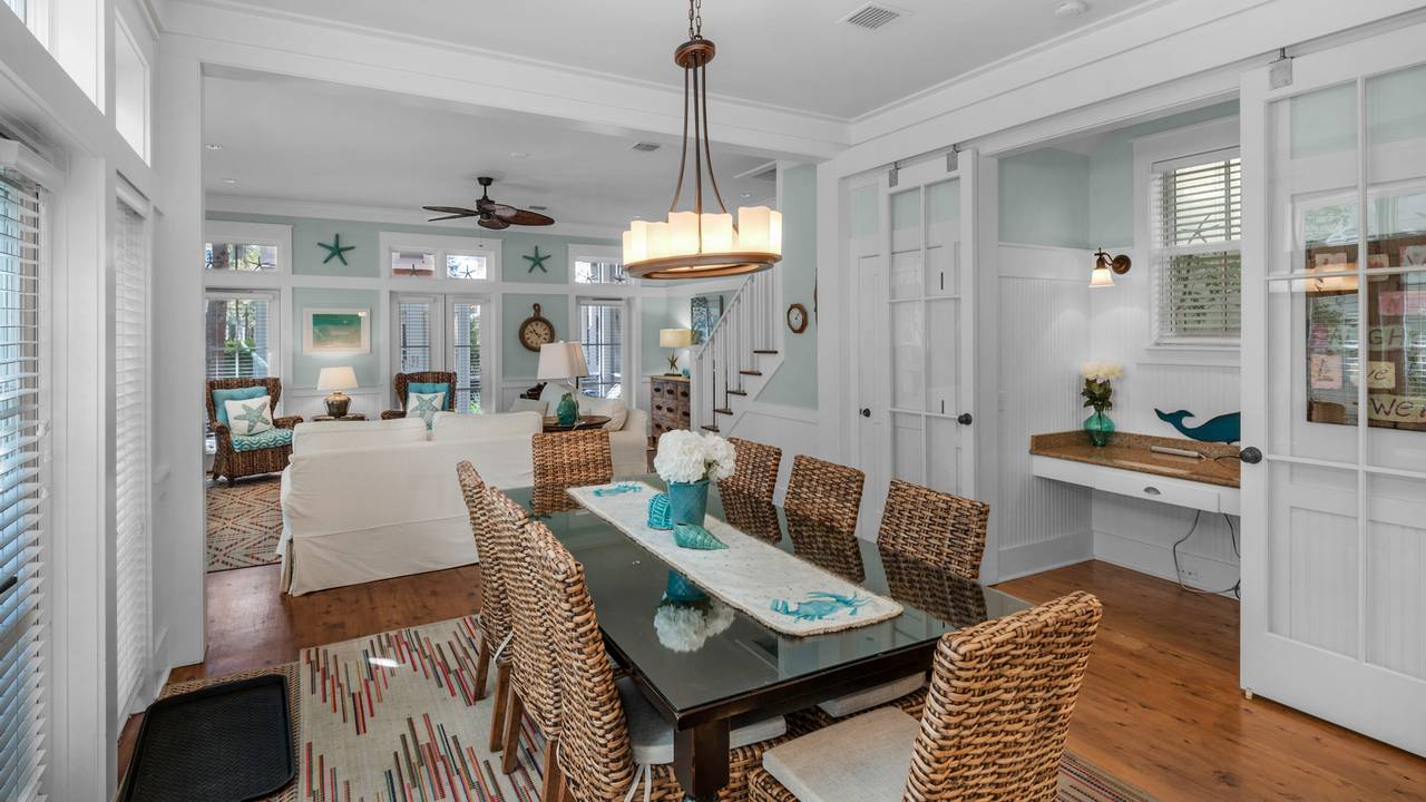 A Whales Tail Dining Table and Living Area A Whales Tail Dining Table and Living Area