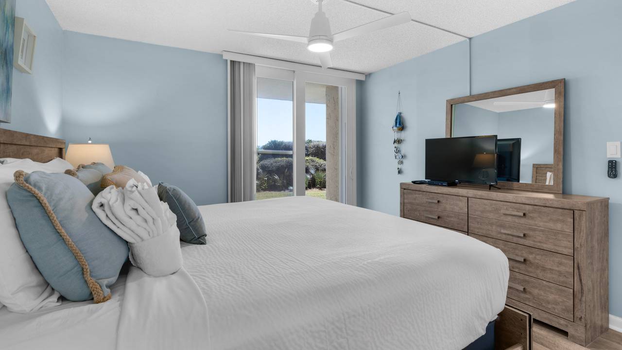BeachCrest 103 Primary Bedroom w/ Patio access BeachCrest 103 Primary Bedroom w/ Patio access