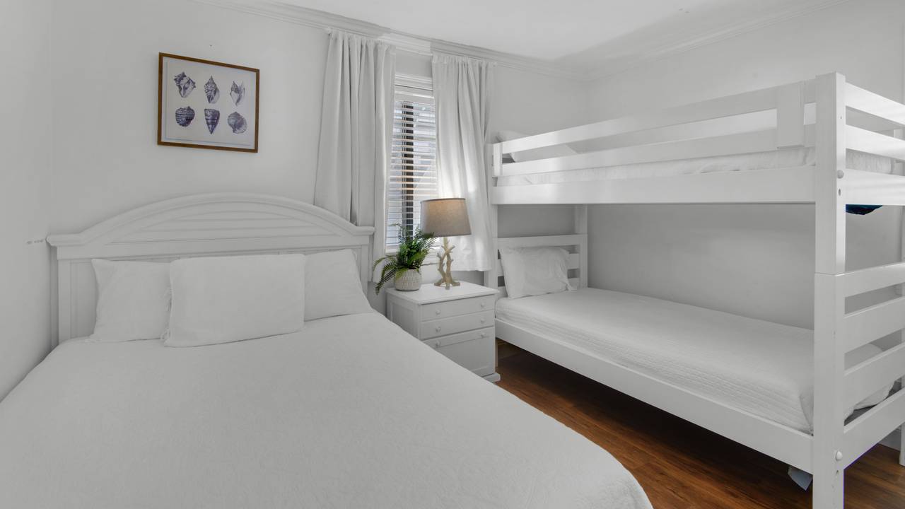 Beachside Condo 1 Guest Bedroom with Queen and Twin Bunks Beachside Condo 1 Guest Bedroom with Queen and Twin Bunks