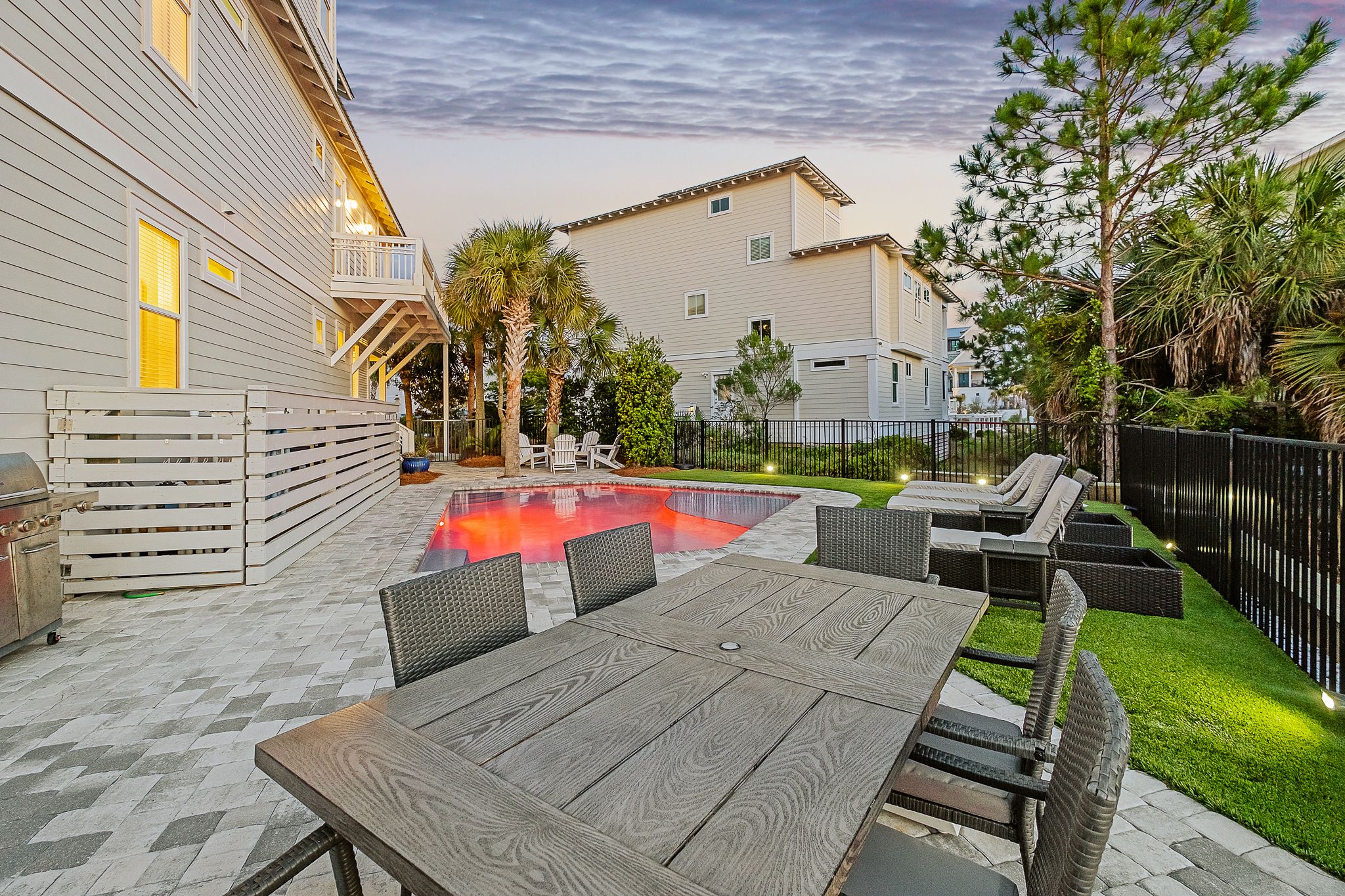 Endless Summer Twilight shot of outdoor dining area & pool