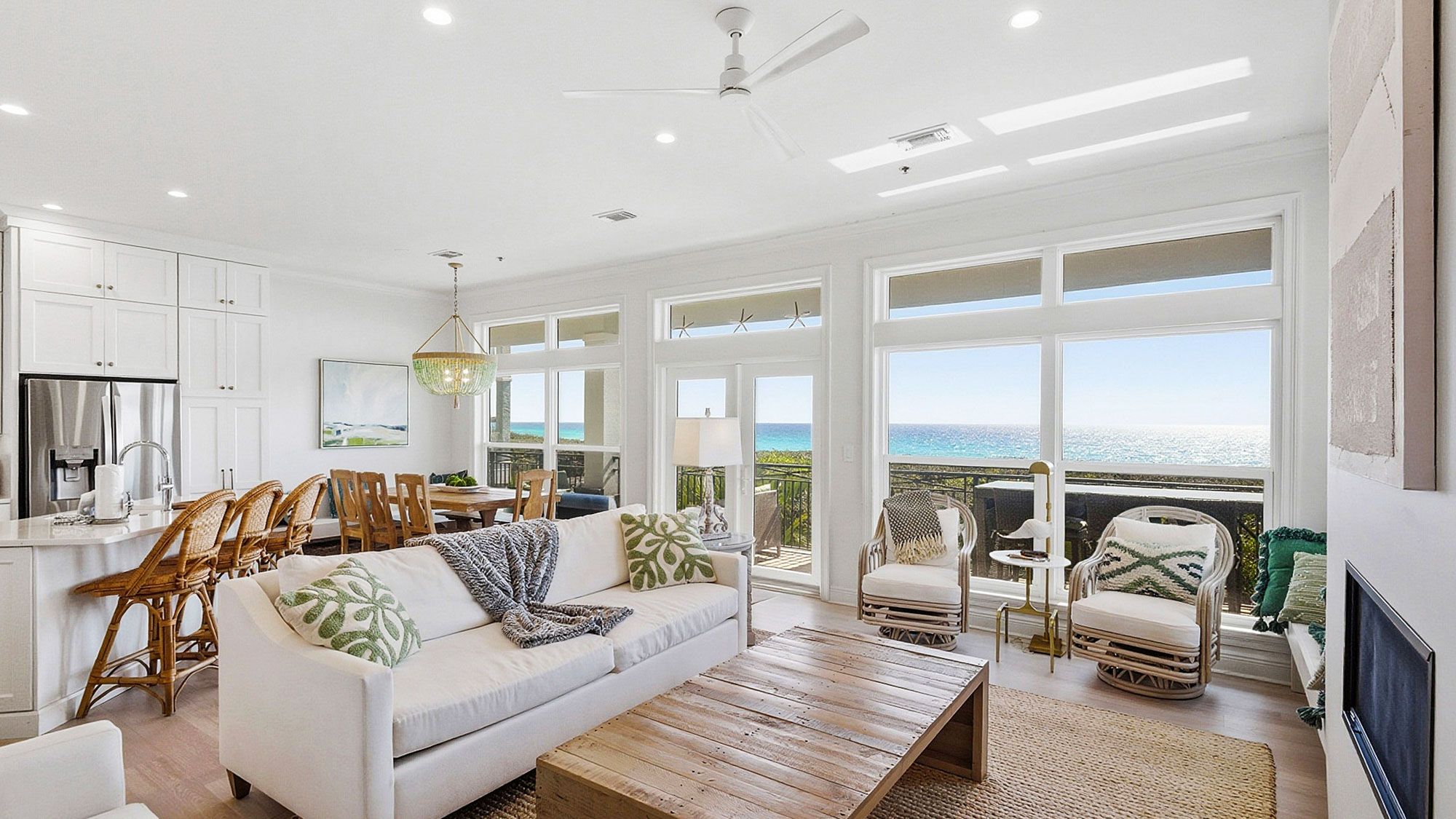 Camelot - Living into dining area with Gulf views 