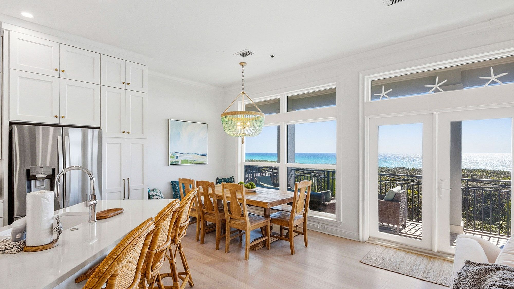 Camelot - Dining area into balcony with outdoor dining and Gulf 