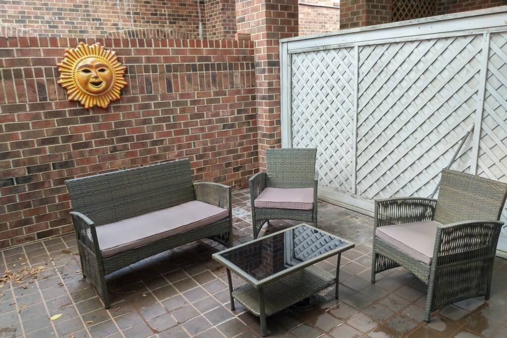 private patio with seating, access off 2nd bedroom