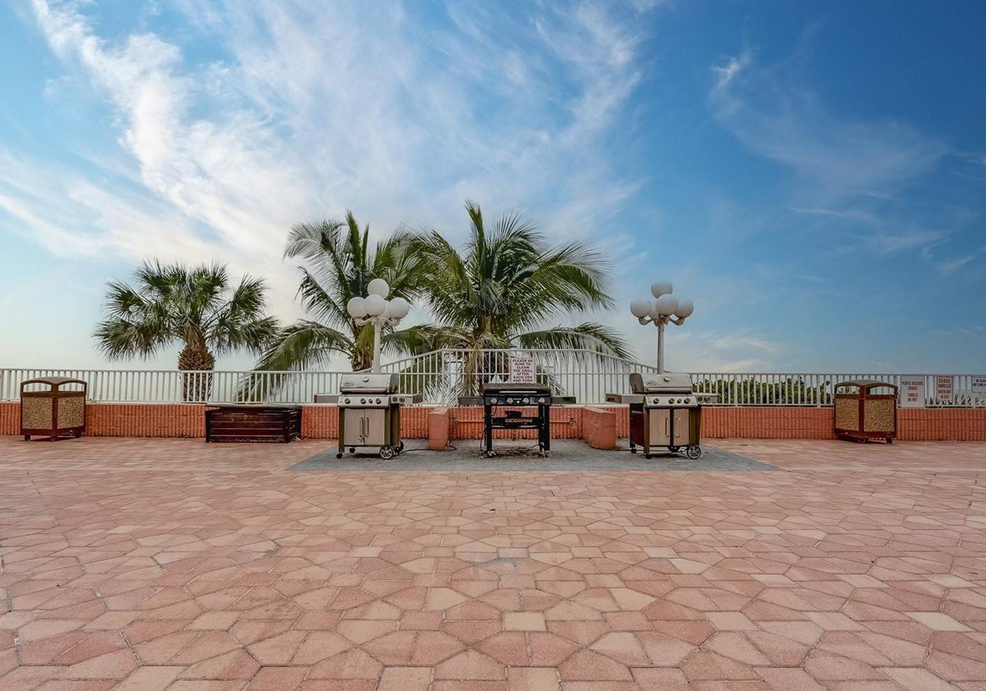 Community grill space at the complex, with a beachfront view!