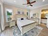 First floor master bedroom with flat screen T.V. and courtyard a