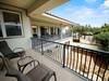 Second floor shared balcony overlooking private courtyard