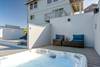 Enjoy the view from the comfy chairs or hot tub