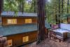 The hot tub is conveniently located behind the house for