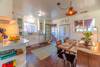The kitchen and dining room are next to the living room
