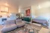 The bedroom is just off the front sitting area