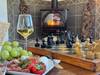 Enjoy a glass of wine by the fire with a game of chess