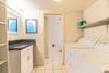 Walk thru the laundry room to the downstairs bath