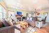There's lots of light, comfy couches & a warm gas fireplace