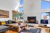 Enjoy the fireplace & leather couches as you watch TV