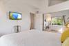 There's also a TV and spacious mirrored closets.