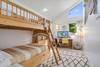 The kids room has twin bunks with a trundle to sleep 3