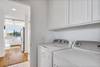 The laundry is in the hall close to the kitchen and bedrooms