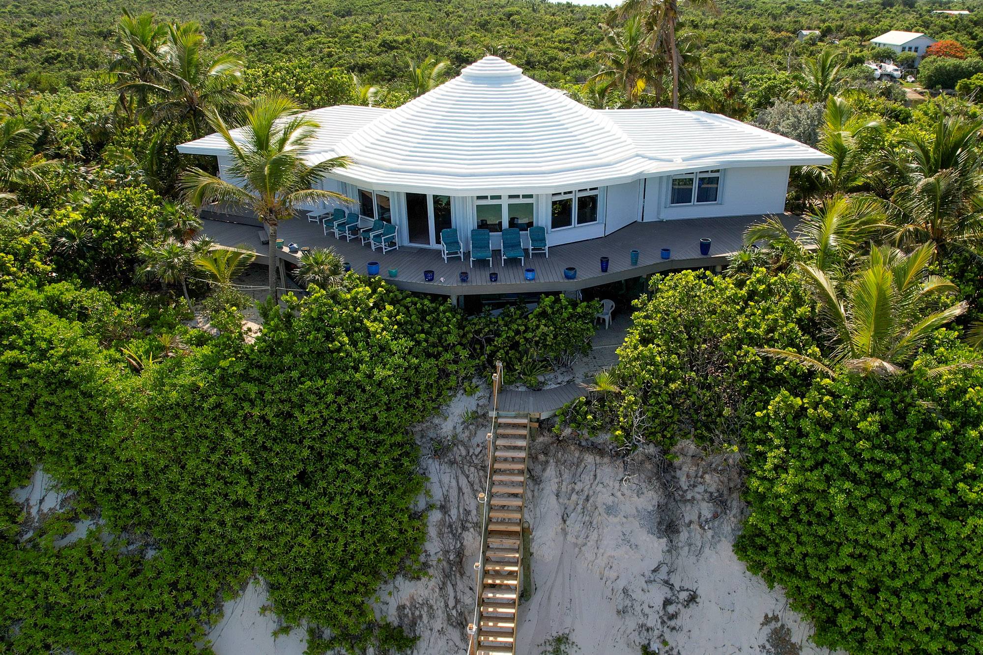 Tropical vegetation surrounds the unique house offering panoramic views from all areas
