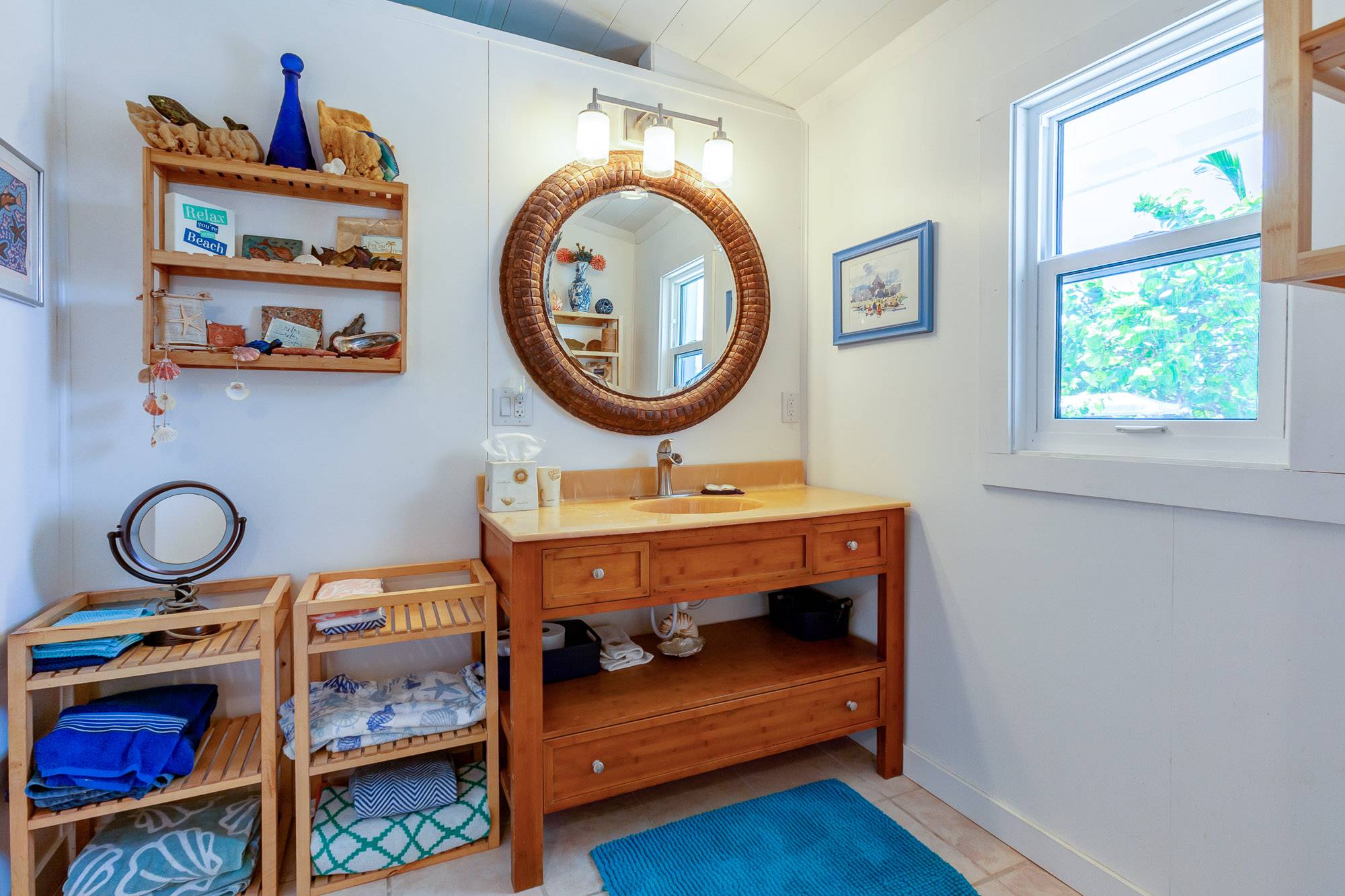 Master bath with unique coconut shell mirror.
