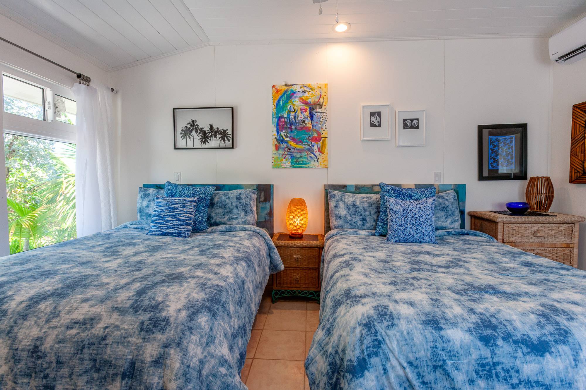 Attractive matching headboards and art work.