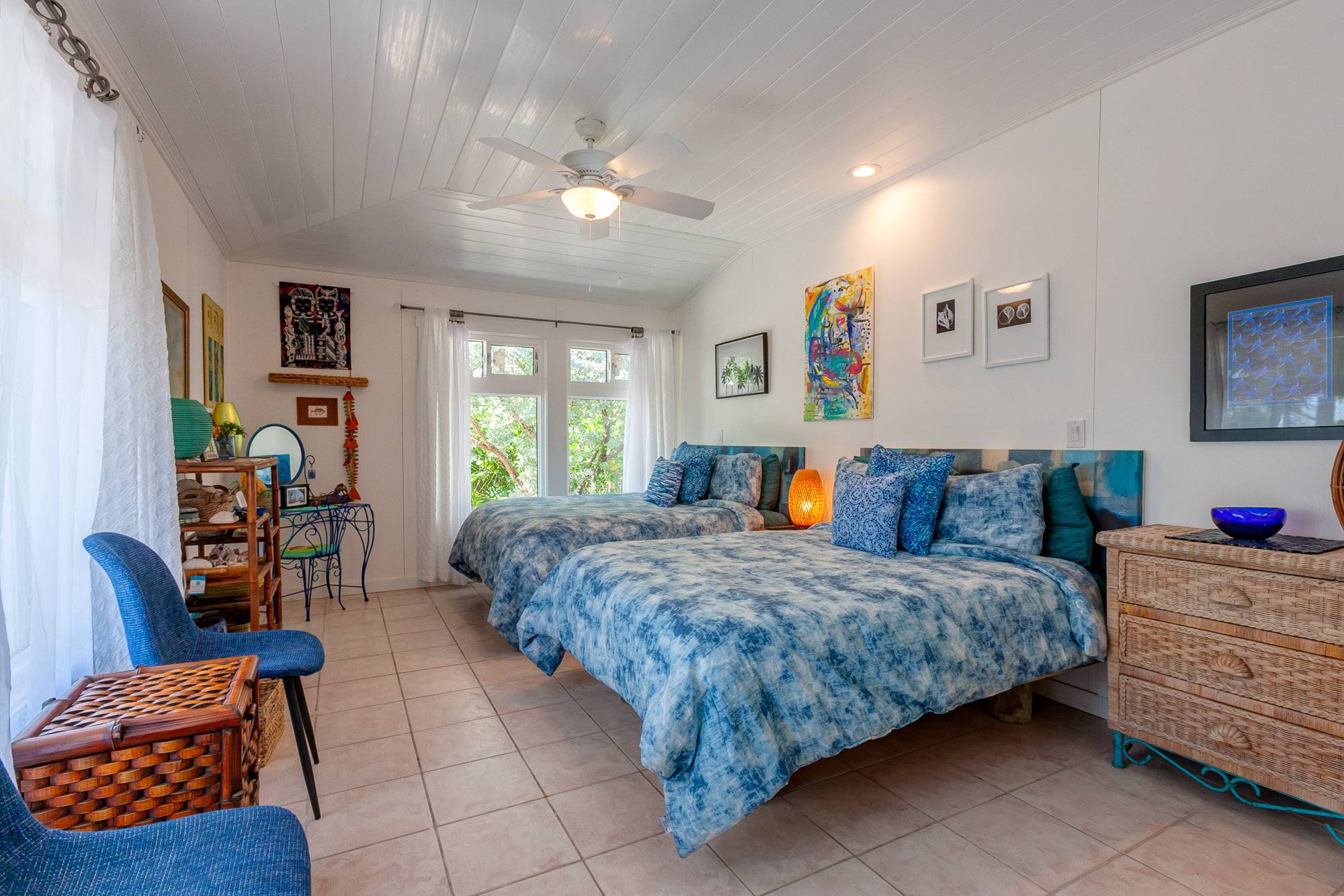 Second guest bedroom with two full sized beds, not singles.