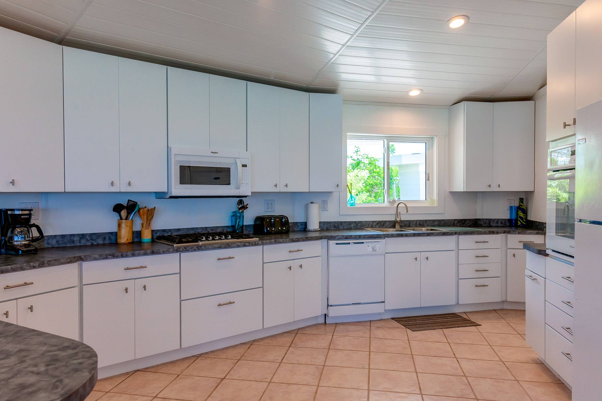 Up to date appliances and fully equipped kitchen necessities.