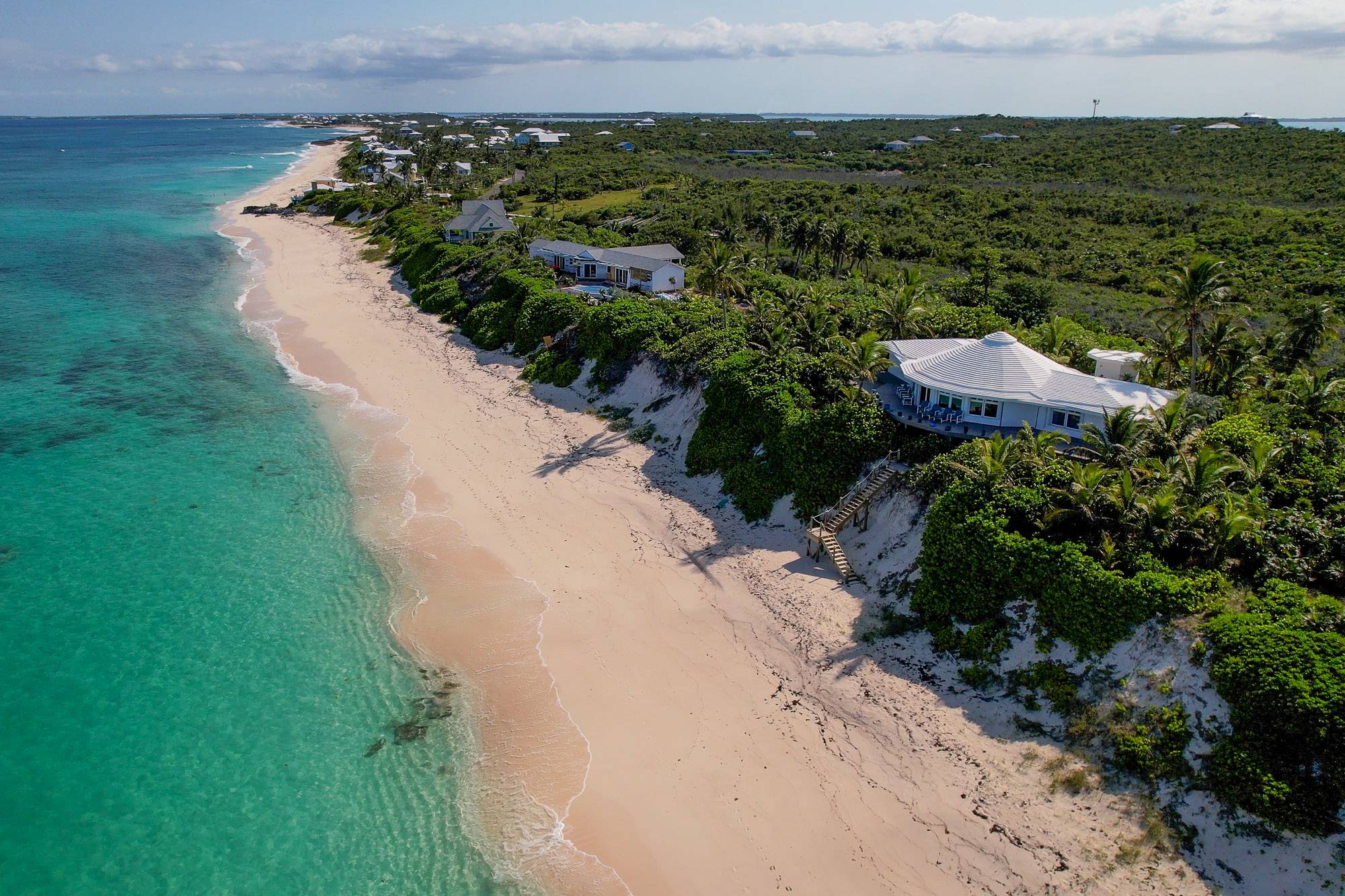  The beach to the south with the southern tip of the island visible in the distance.