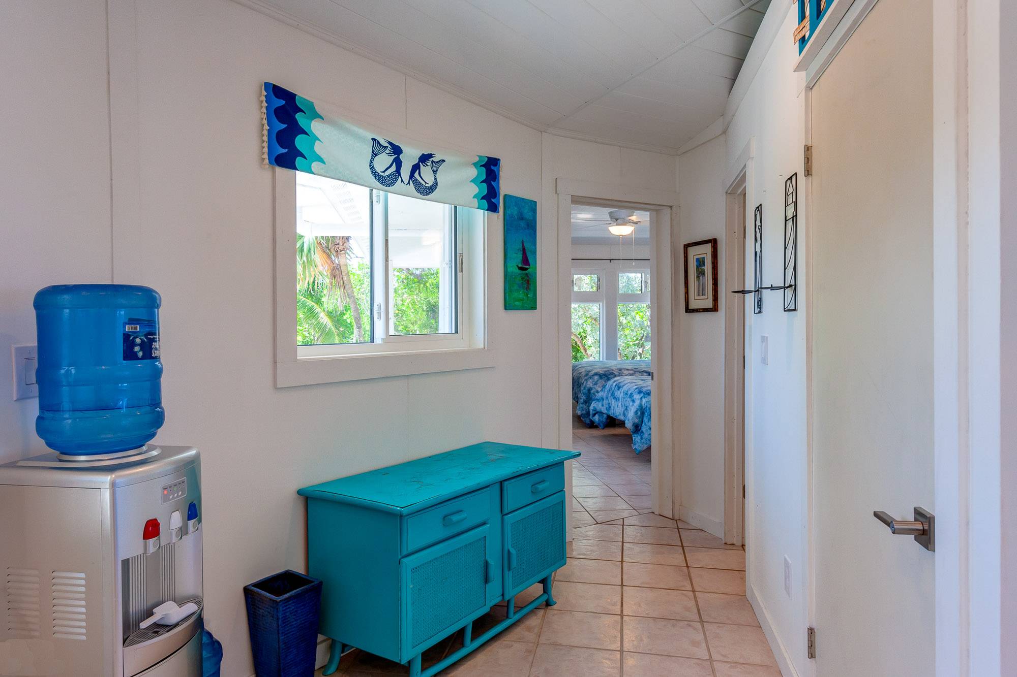 Rear entry hallway with all purpose water dispenser (cold water, hot water and full time ice maker.