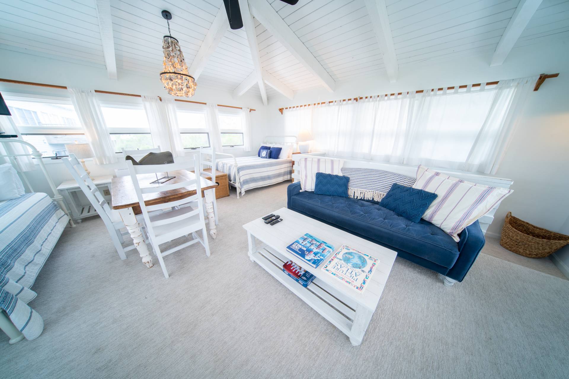 Upstairs loft bedroom w/ 2 Twins, 1 Double and 1 Twin Futon.  TV and game table!