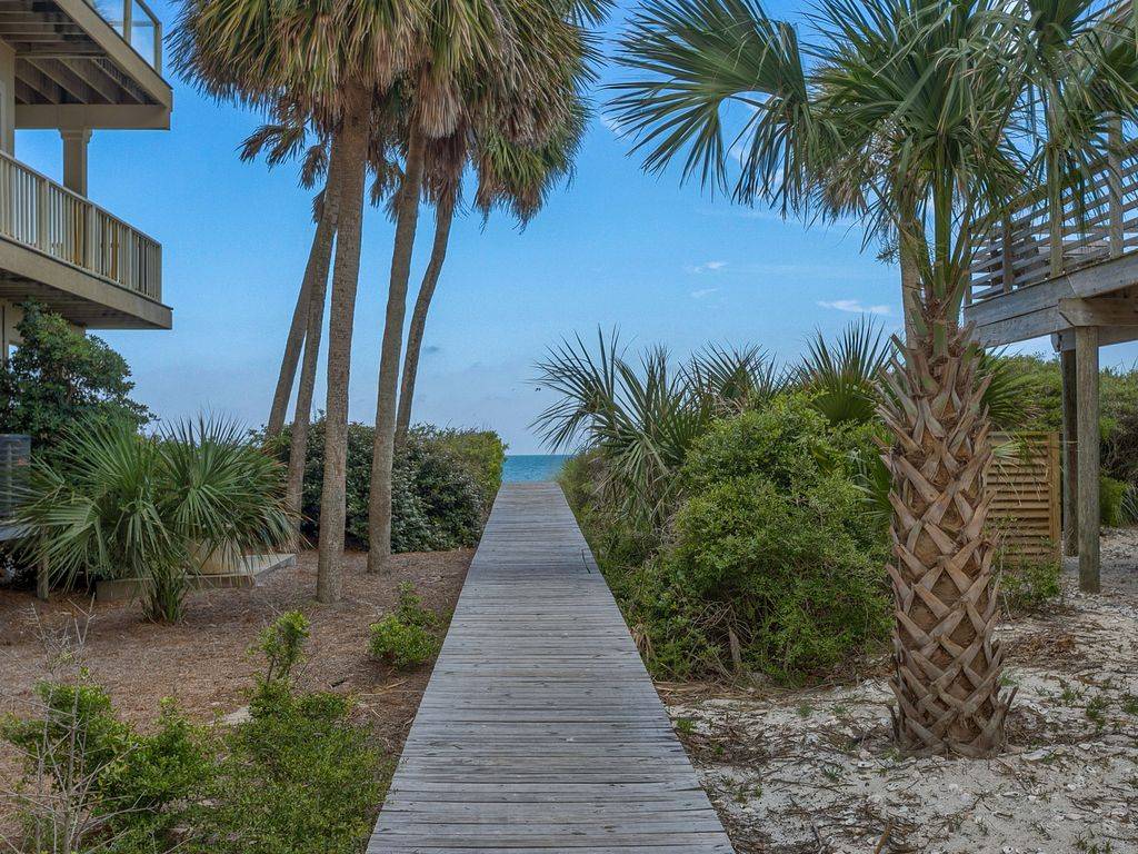 Community boardwalk access to beach, just a few steps away