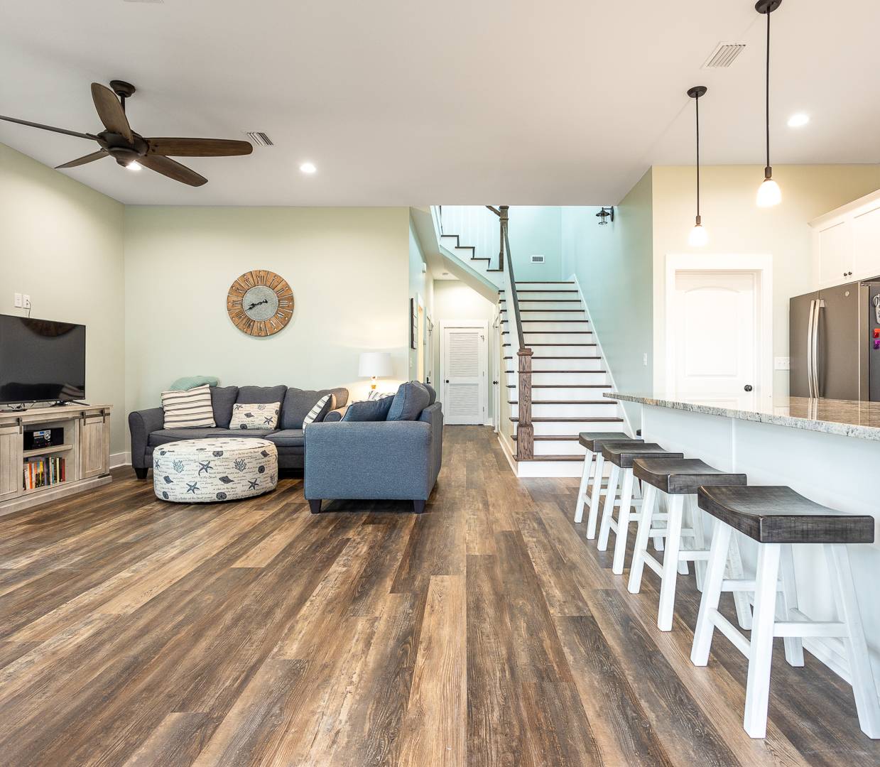 Living Area with Queen sleeper sofa, dining area, kitchen and laundry room.  Opens to screened and sundeck.