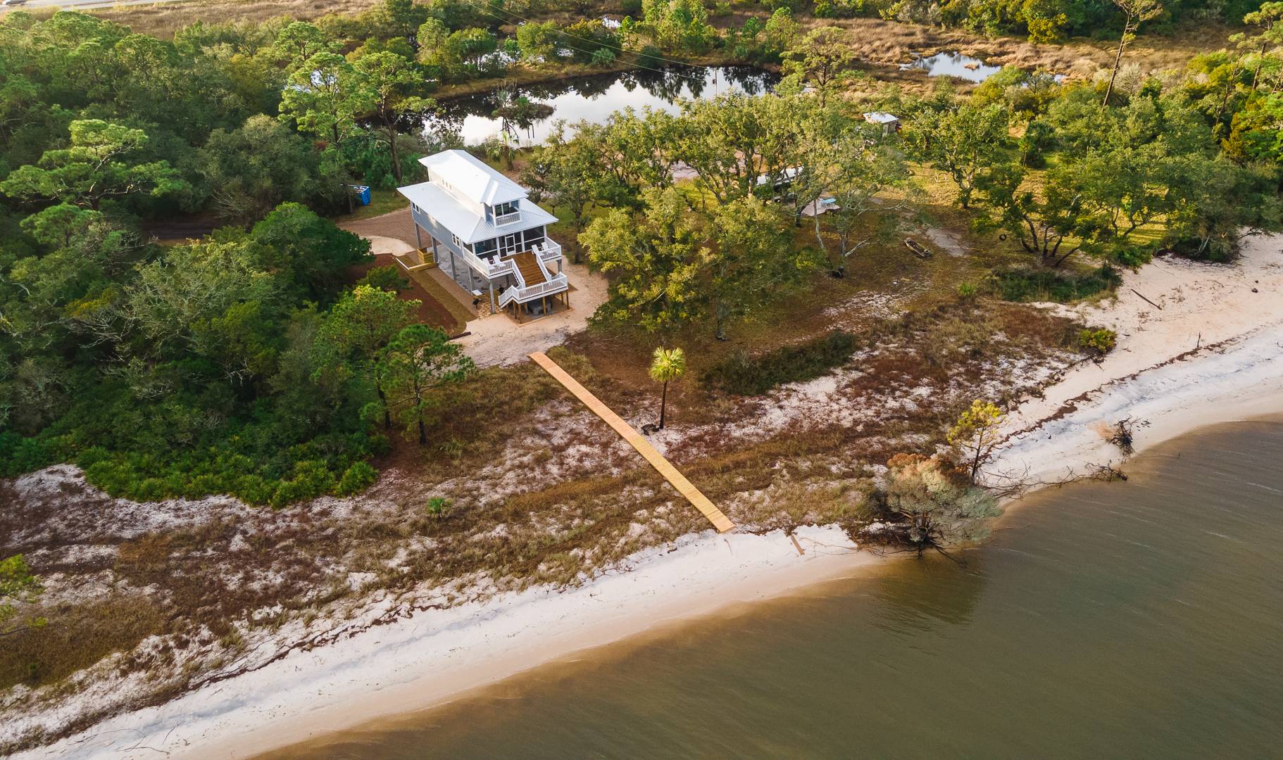 Bird's Eye View of the private lot with Bayfront access and pond