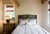 Upstairs bedroom with queen bed and full bath.