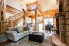 Living room with gas log fireplace and flat screen TV.
