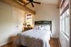 Upstairs bedroom with queen bed and full bath.