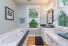 Master bathroom with soaking tub and walk-in shower.