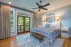 Master bedroom with king. French doors out to porch.
