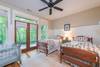 Twin bedroom with doors to terrace. Pack n Play available.