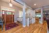 Entry way opens into living area, with stairs to lower level.