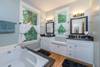 Master bathroom with double sinks.