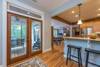 Double doors leading out to screened in porch.