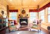 Sunroom features an electric fireplace.