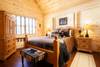 Main level guest suite with queen bed.