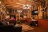 Bunk room includes sitting area to watch TV.